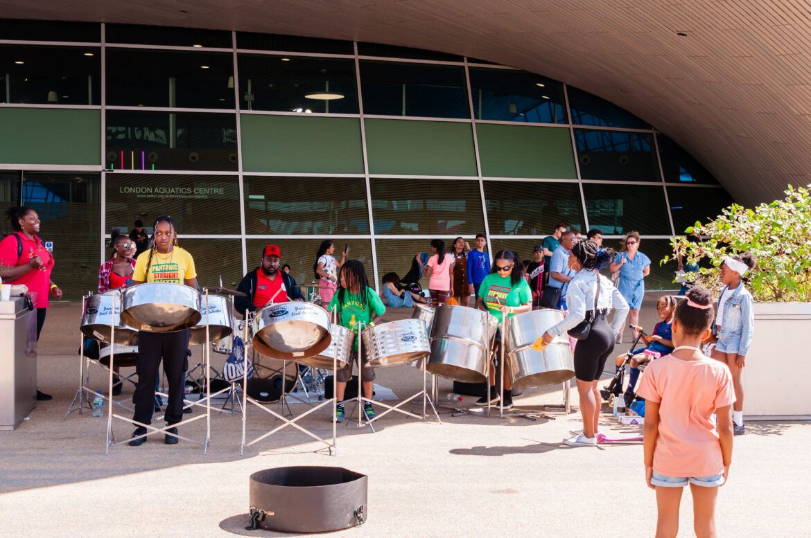 crowd gathered to watch a drumming performance in at the olympic aquatics centre in London